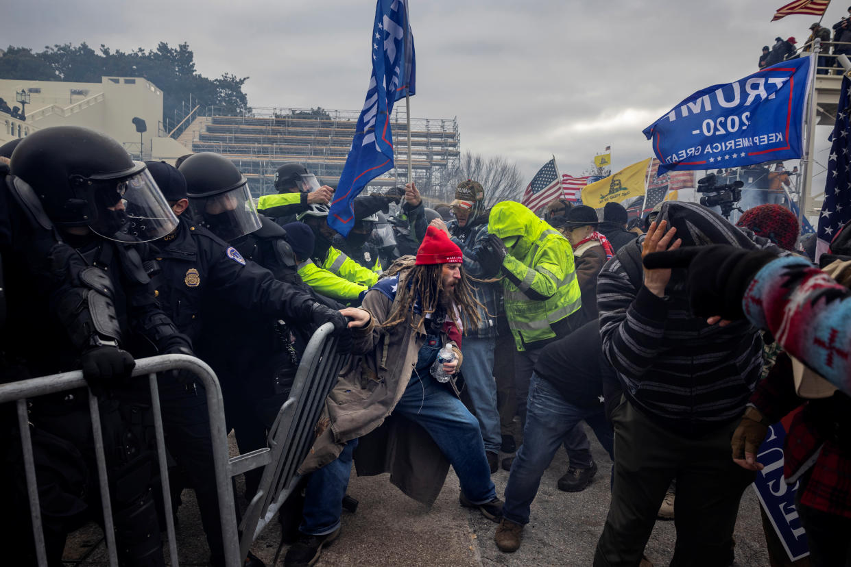 Trump supporters clash with police and security forces outside the U.S. Capitol on Jan. 6. (Brent Stirton/Getty Images)
