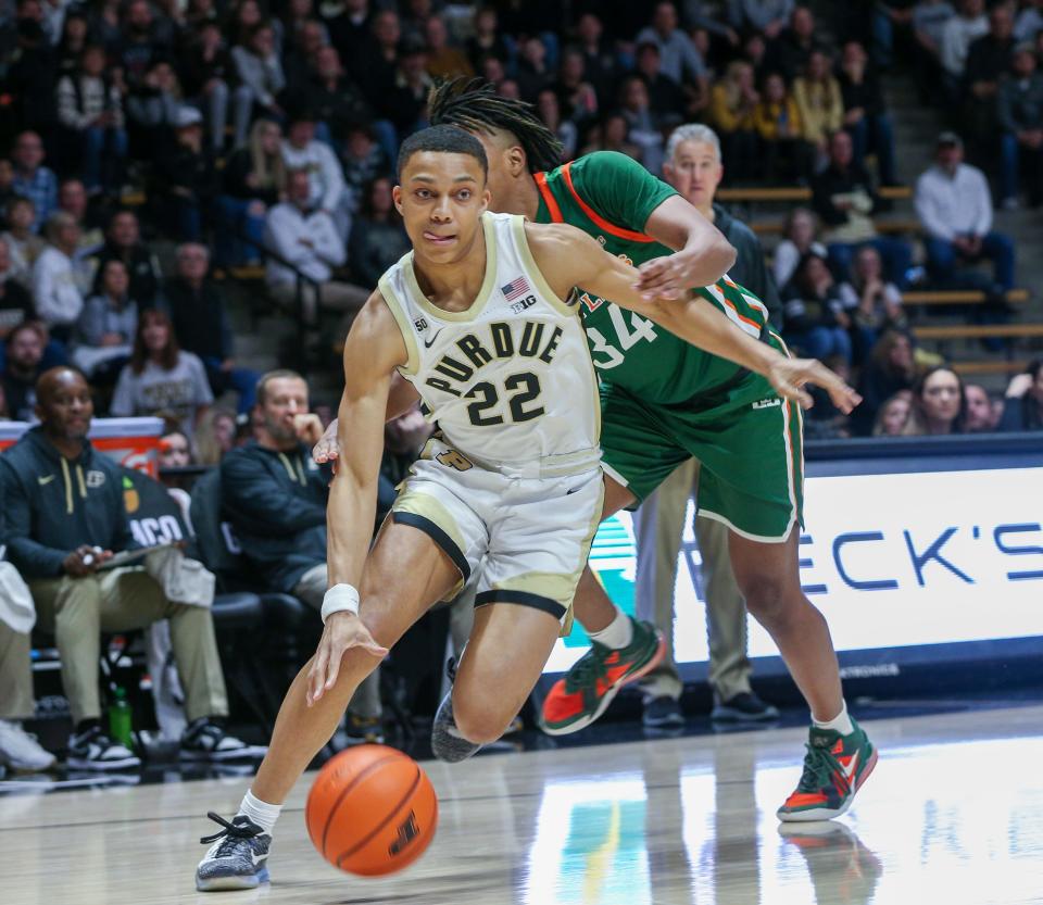 Purdue Boilermakers guard Chase Martin (22) breaks away from Florida A&M Rattlers guard Richard Mathews (34) during the NCAA men’s basketball game against the Florida A&M Rattlers, Thursday, Dec. 29, 2022, at Mackey Arena in West Lafayette, Ind. Purdue won 82 – 49.