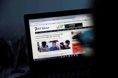 A reporter shows the news about journalists who were detained by Myanmar Military, in the Democratic Voice of Burma (DVB) news room in Yangon, Myanmar June 29, 2017. REUTERS/Soe Zeya Tun