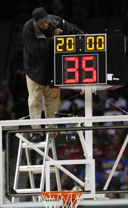 College basketball will likely trim its shot clock from 35 to 30 seconds next season. (AP)