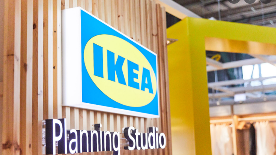 An IKEA planning studio sign on the interior of a building.