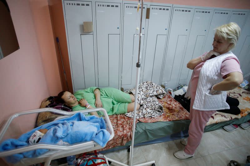 Patients take shelter in the basement of a perinatal centre as air raid siren sounds are heard amid Russia's invasion of Ukraine, in Kyiv