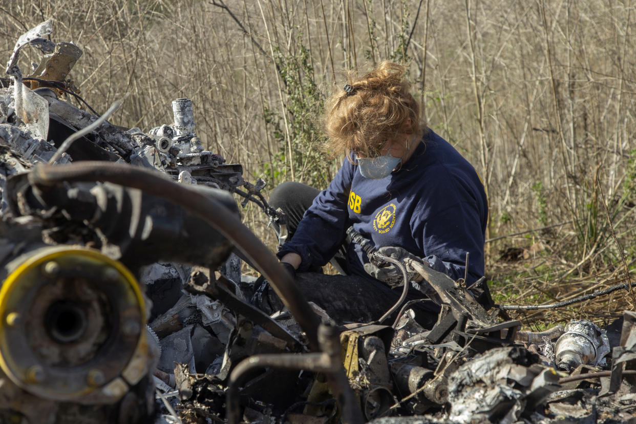 CALABASAS, CA - JANUARY 27: In this handout photo provided by the National Transportation Safety Board, an investigator works at the scene of the helicopter crash that killed former NBA star Kobe Bryant and his 13-year-old daughter Gianna on January 27, 2020 in Calabasas, California. All nine people on board, including the pilot, perished in the crash as they were flying to Bryant's Mamba Sports Academy in Thousand Oaks, where he was going to coach Gianna in a tournament game. (Photo by James Anderson/National Transportation Safety Board via Getty Images)