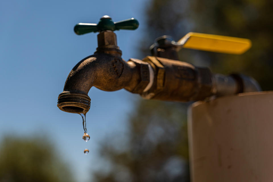 Water drips from an old outside tap