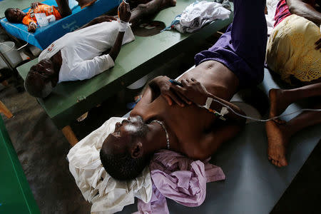 People are treated at a cholera treatment center at a hospital after Hurricane Matthew passed through Jeremie, Haiti, October 11, 2016. REUTERS/Carlos Garcia Rawlins
