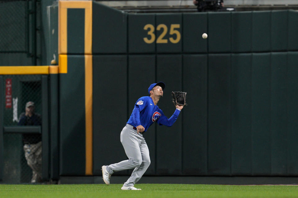 Chicago Cubs right fielder Seiya Suzuki (27) catches a fly ball hit by Cincinnati Reds' Jonathan India during the third inning of a baseball game Tuesday, Oct. 4, 2022, in Cincinnati. (AP Photo/Jeff Dean)