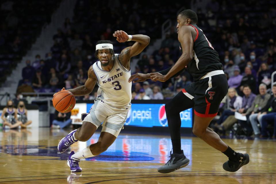 Kansas State's Selton Miguel (3) dribbles against Texas Tech's Bryson Williams (11) during a Big 12 Conference game Saturday at Bramlage Coliseum in Manhattan, Kansas.