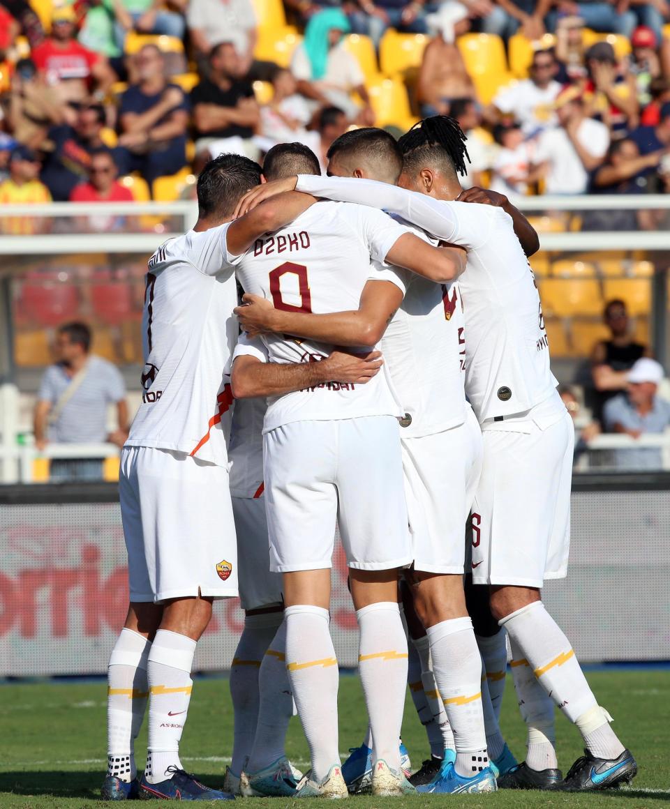 Roma's Edin Dzeko, center, back to camera, celebrates with his teammates after scoring during the Italian Serie A soccer match between Lecce and Roma at the Via del Mare stadium in Lecce, Italy, Saunday, Sept. 29, 2019. (Marco Lezzi/ANSA Via AP)