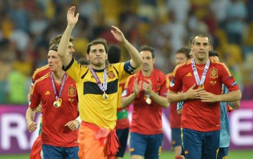 Spanish goalkeeper Iker Casillas waves to supporters after winning the Euro 2012 football championships final match Spain vs Italy at the Olympic Stadium in Kiev. Spain won 4-0