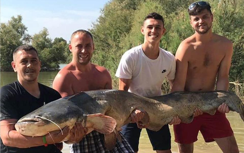 Phil Foden catches a 130lb catfish while on holiday in Spain