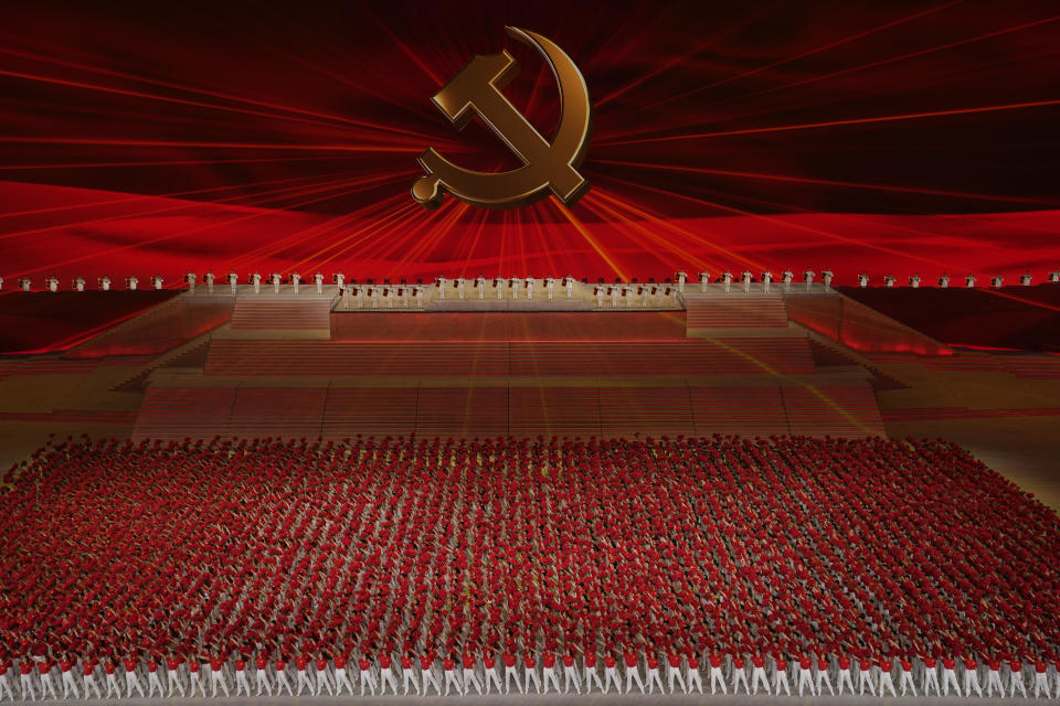 Performers form up under the Communist Party emblem during a gala show ahead of the 100th anniversary of the founding of the Chinese Communist Party in Beijing on Monday, June 28, 2021. For China's Communist Party, celebrating its 100th birthday on Thursday, July 1 is not just about glorifying its past. It's also about cementing its future and that of its leader, Chinese President Xi Jinping. (AP Photo/Ng Han Guan)