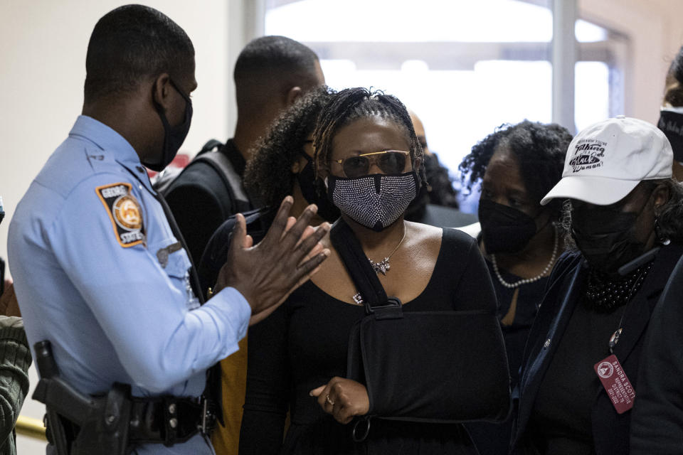 Georgia State Rep. Park Cannon, D-Atlanta, walks past a Georgia State Patrol officer as she returns to the State Capitol in Atlanta on Monday morning, March 29, 2021 after being arrested last week for knocking on the governor's office door as he signed voting legislation. (AP Photo/Ben Gray)