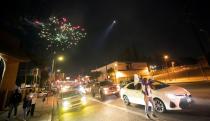 People celebrate Los Angeles Dodgers' victory at the end of game 6 of the 2020 World Series between Los Angeles Dodgers and Tampa Bay Rays, amidst the outbreak of the coronavirus disease (COVID-19), in Los Angeles