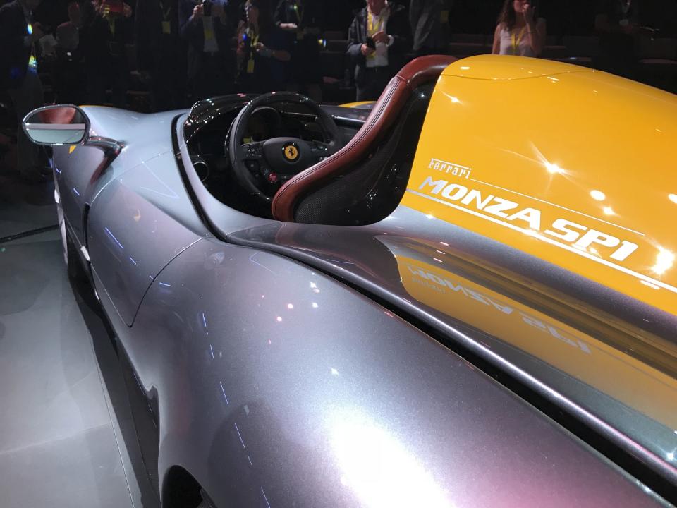 The Ferrari Monza SP1 is displayed in Maranello, Italy, Tuesday, Sept. 18, 2018. Sportscar maker Ferrari has unveiled two updated versions of its classic open-top "barchetta" racing model as it briefs investors on a new five-year business plan. Nicolo Boari, the head of product marketing, said Tuesday that the Ferrari Monza SP1 and SP2 are "the most powerful ever in Ferrari history," with an 810 horsepower engine able to reach 100 kilometers per hour (62 mph) in 2.9 seconds. (AP Photo/Collen Barry)