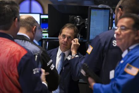 Traders work on the floor of the New York Stock Exchange October 20, 2014. REUTERS/Brendan McDermid