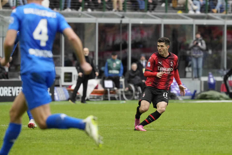 AC Milan's Christian Pulisic scores his side's opening goal during a Serie A soccer match between AC Milan and Empoli at the San Siro stadium in Milan, Italy, Sunday, March 10, 2024. (AP Photo/Luca Bruno)