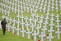 <p>A man walks through the American Military Cemetery in Falciani, Italy, on the outskirts of Florence, during a ceremony marking Memorial Day, 30 May 2016. (Photo: Maurizio degl’Innocenti/EPA) </p>