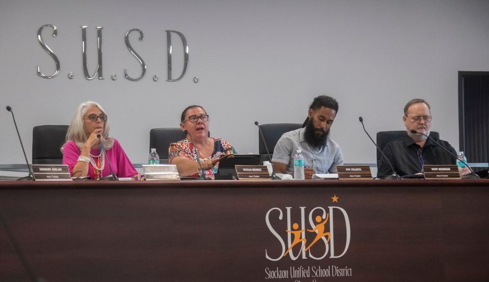 Stockton Unified School District interim superintendent Dr. Traci E Miller, left, board president Cecilia Mendez, board members Ray Zulueta and Scot McBrian attend a town hall meeting about the critical grand jury report at the SUSD headquarters in downtown Stockton. 