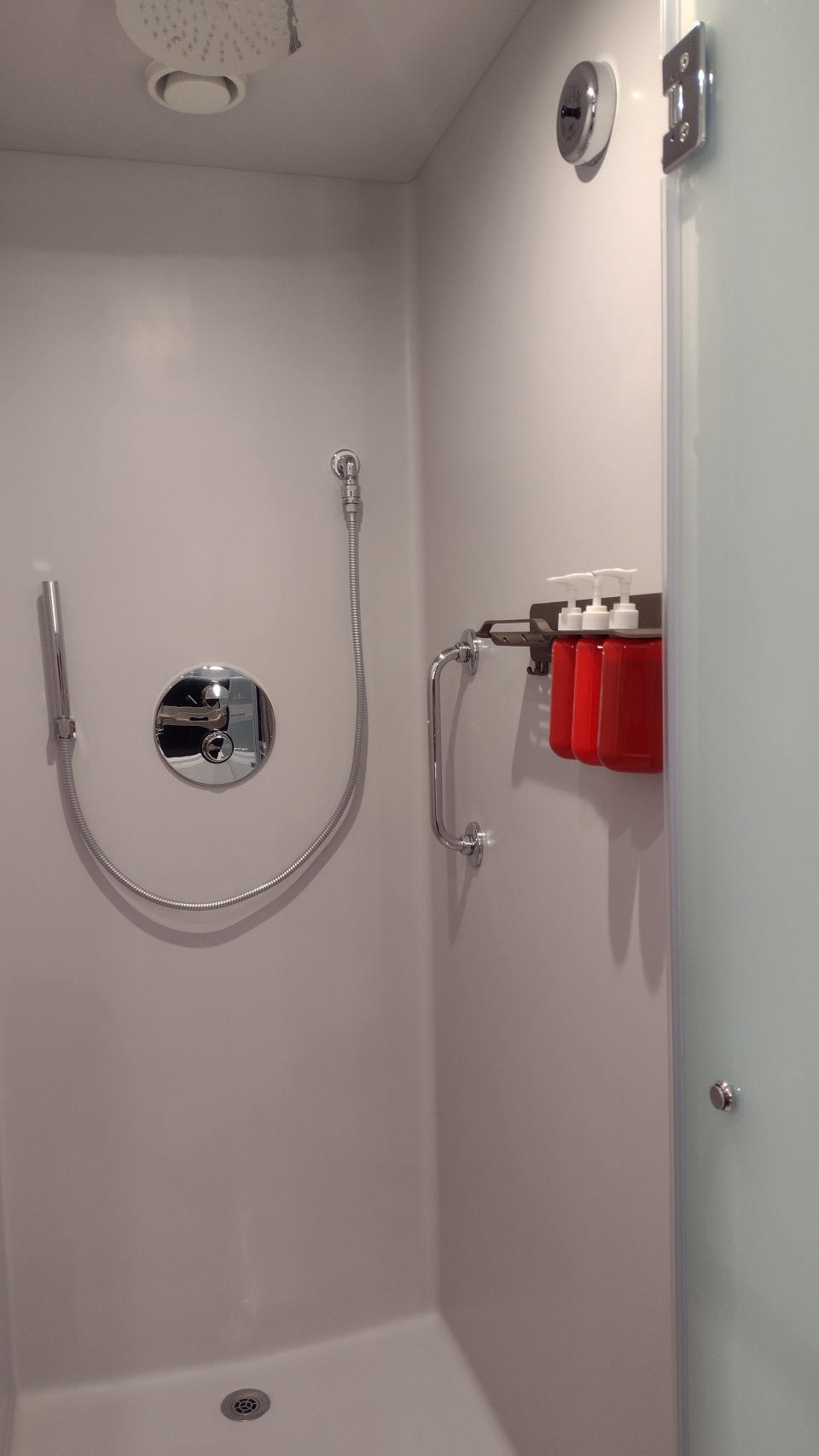 A small shower in a cruise cabin bathroom.
