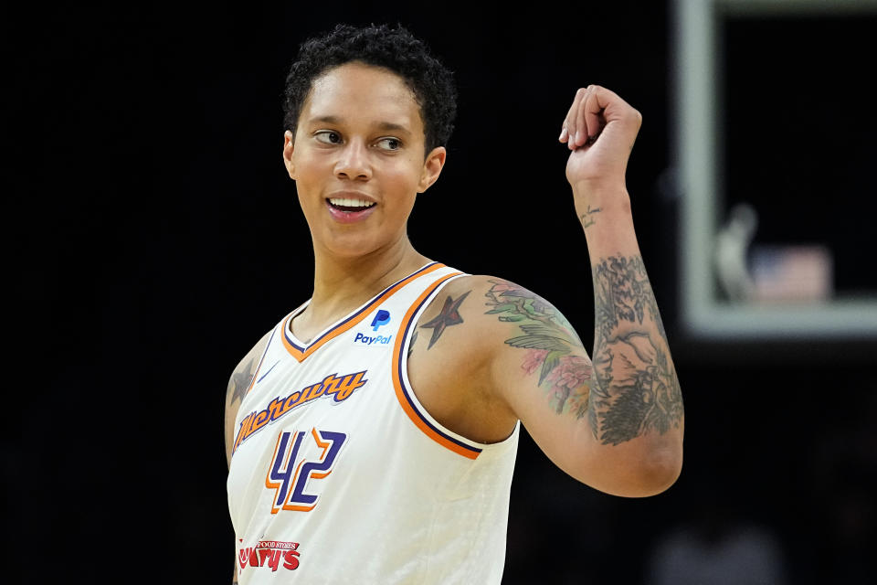 Phoenix Mercury center Brittney Griner smiles during the first half of a WNBA preseason basketball game against the Los Angeles Sparks, Friday, May 12, 2023, in Phoenix. (AP Photo/Matt York)