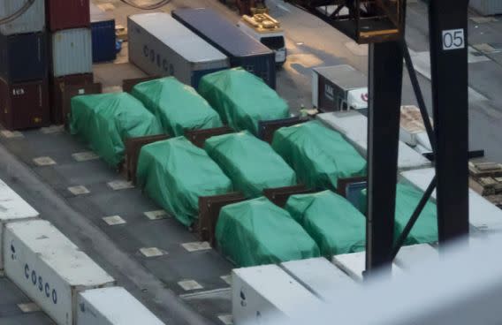 This Thursday, Nov. 24, 2016 photo shows nine eight-wheeled Singapore-made Terrex infantry carrier vehicles seized at a container terminal in Hong Kong. Singapore's army is sending a team to Hong Kong to secure the nine of its armored personnel carriers that were seized by customs authorities while in transit through the southern Chinese territory, the Defense Ministry said Friday, Nov. 25. (AP Photo/Kin Cheung)