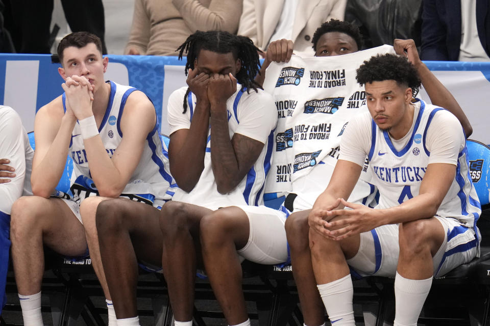 Players on the Kentucky bench watch late in the second half of the team's college basketball game against Oakland in the first round of the men's NCAA Tournament in Pittsburgh, Thursday, March 21, 2024. Oakland won 80-76. (AP Photo/Gene J. Puskar)