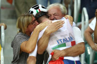 <p>Elia Viviani of Italy celebrates with his parents after winning the Cycling Track Men’s Omnium Points Race 66 on Day 10 of the Rio 2016 Olympic Games at the Rio Olympic Velodrome on August 15, 2016 in Rio de Janeiro, Brazil. (Photo by Bryn Lennon/Getty Images) </p>
