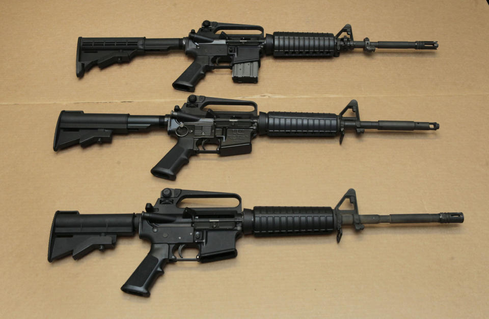 FILE - Three variations of the AR-15 assault rifle are displayed at the California Department of Justice in Sacramento, Calif., on Aug. 15, 2012. A federal judge who previously overturned California's three-decade-old ban on assault weapons did it again on Thursday, Oct. 19, 2023, ruling that the state's attempts to prohibit sales of semiautomatic guns violates the constitutional right to bear arms. (AP Photo/Rich Pedroncelli, File)