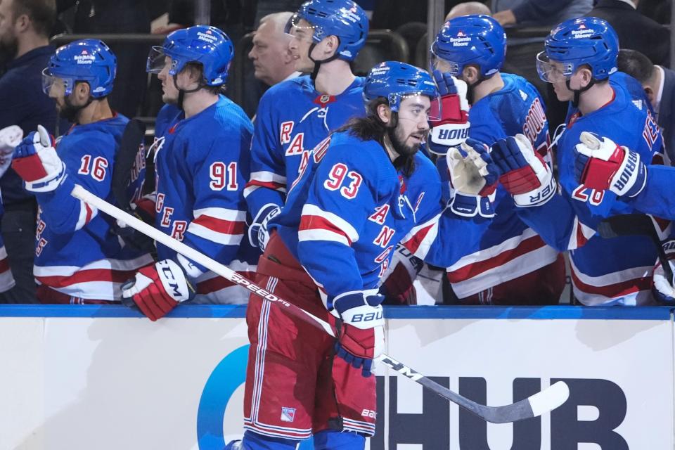 New York Rangers' Mika Zibanejad (93) celebrates with teammates after scoring during the third period of an NHL hockey game against the Seattle Kraken, Friday, Feb. 10, 2023, in New York. (AP Photo/Frank Franklin II)