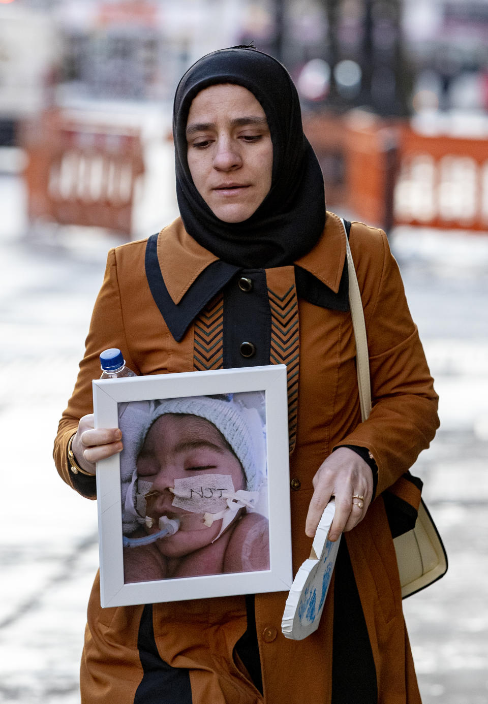 Shokhan Ali, the mother of Midrar Ali, arrives ahead of a hearing at The Family Court in Preston. (PA Images) 