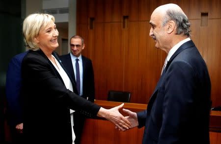 Marine Le Pen, French National Front (FN) political party leader and candidate for the French 2017 presidential elections, shakes hands with Samir Geagea, leader of the Christian Lebanese Forces, in Maarab, north of Beirut, Lebanon February 21, 2017. REUTERS/Mohamed Azakir