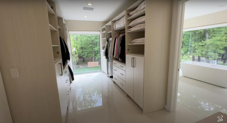 The walk-in closet off of the first-floor guest bedroom in Aaron Rodgers' New Jersey home.