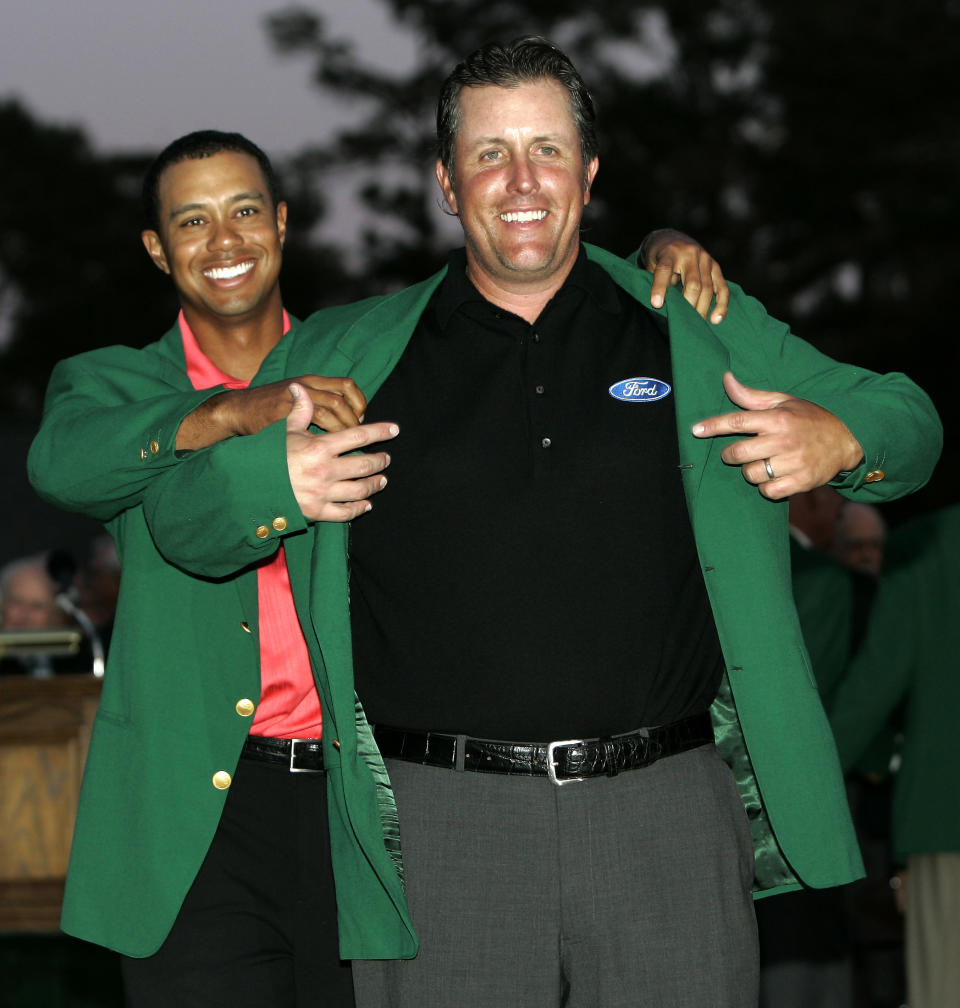 <p>Phil Mickelson, right, gets his Masters Green Jacket from last years champion Tiger Woods after winning the 2006 Masters golf tournament at the Augusta National Golf Club in Augusta, Ga., Sunday, April 9, 2006. (AP Photo/Amy Sancetta) </p>