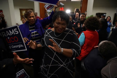 FILE PHOTO: Stacey Abrams,Democratic gubernatorial candidate for Georgia, is welcomed by a crowd of supporters in Fayetteville, Georgia, U.S., October 25, 2018. REUTERS/Lawrence Bryant/File Photo