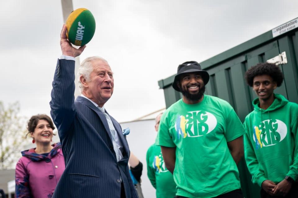The Prince of Wales throwing an American football during a visit to the Bigkid Foundation in south London (Aaron Chown/PA) (PA Wire)