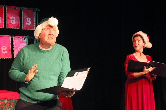 Tim Connors, left, plays the Grinch in a scene with Becky Connors during the 2019 performance of  &quot;Christmas Memories&quot; at Freeport High School.
