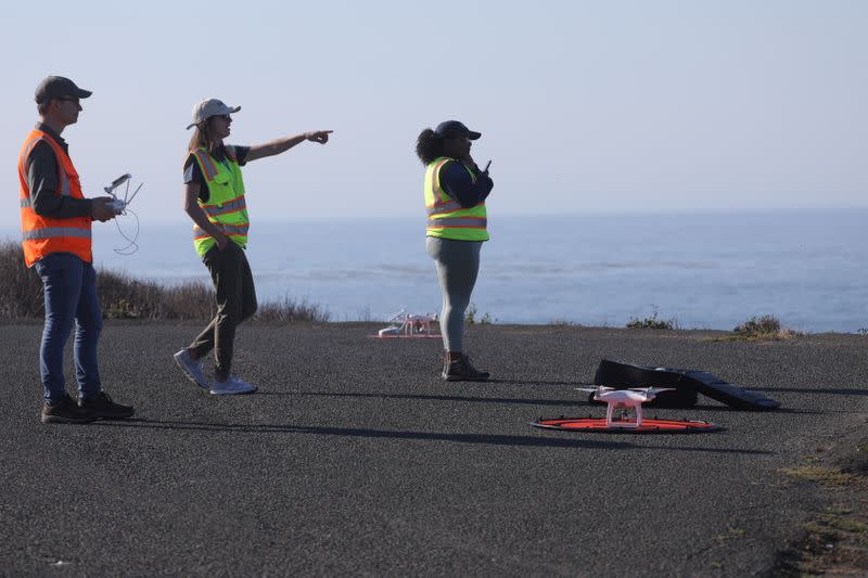 Nature Conservancy scientists Kirk Klausmeyer, Vienna Saccomanno, and Breonna Jones prepare for a drone survey of a kelp forest in Saunders Reef near Gualala, California