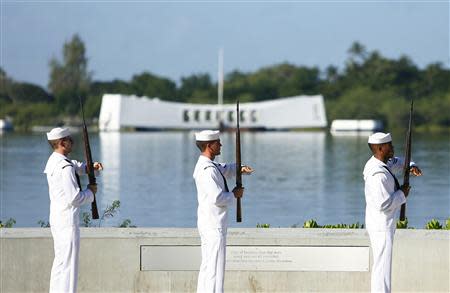 The U.S. Navy Ceremonial Guard performs a rifle salute at the Arizona Memorial during the 72nd anniversary of the attack on Pearl Harbor at the WW II Valor in the Pacific National Monument in Honolulu, Hawaii on December 7,2013. REUTERS/Hugh Gentry