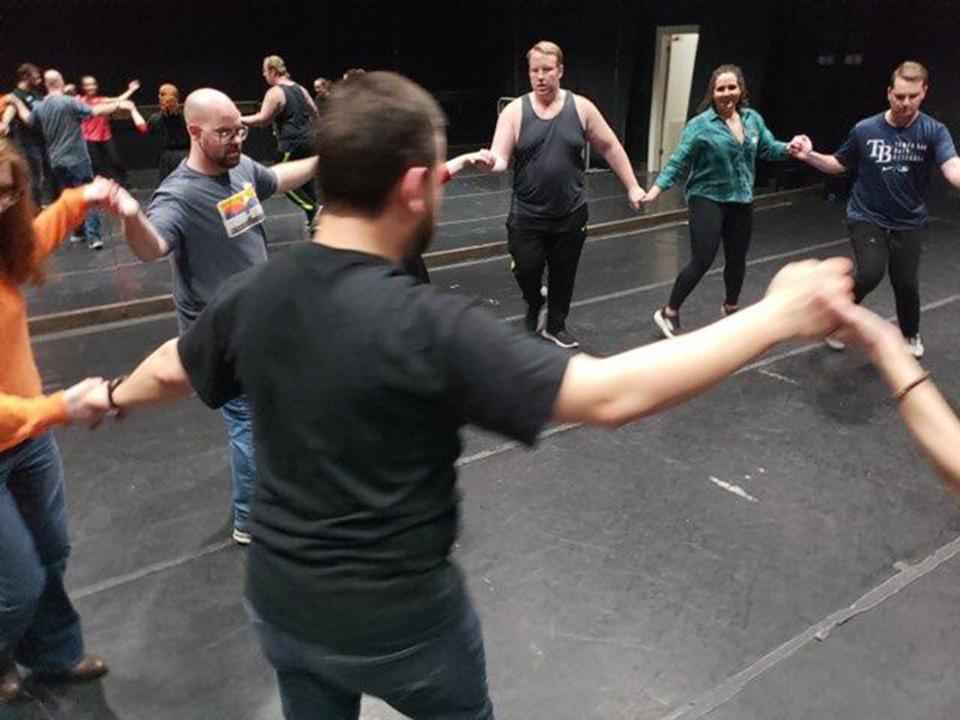 Guests learn the Kalamatianos during a Greek folk dance class at Montgomery Ballet.