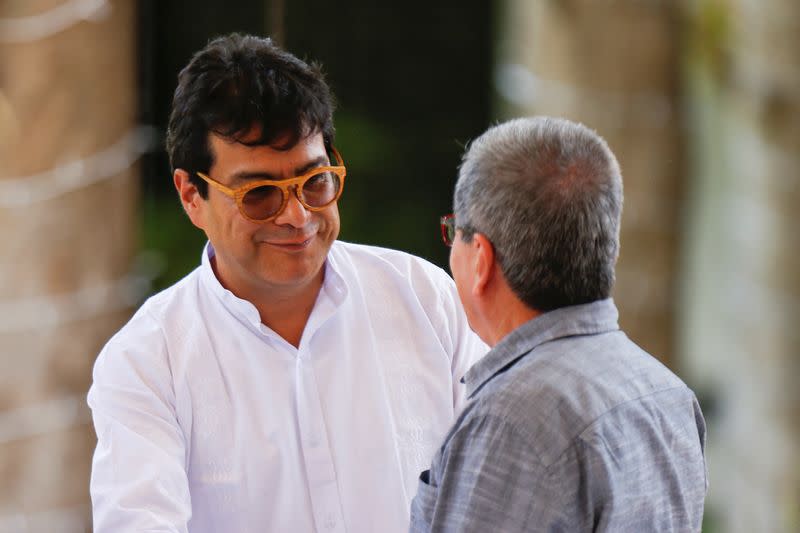 Members of Colombia's government and Colombia's National Liberation Army (ELN) delegation address the media, in Caracas