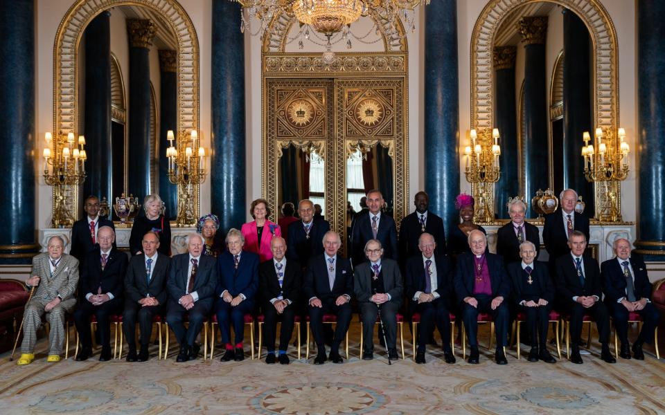 Members of the Order pose for a group portrait - Aaron Chown/PA