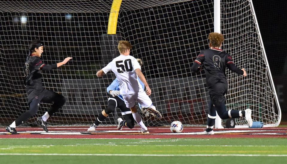 Tyler Cash scores one of his two goals in Oak Park's 5-0 win over Oaks Christian in a nonleague match on Wednesday, Dec. 14, 2023.