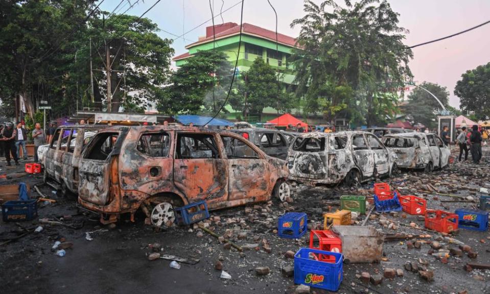 Cars burned by protesters in Jakarta