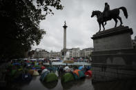 Extinction Rebellion climate change protester tents are setup in Trafalgar Square, London, Friday, Oct. 11, 2019. Some hundreds of climate change activists are in London during a fifth day of protests by the Extinction Rebellion movement to demand more urgent actions to counter global warming. (AP Photo/Matt Dunham)