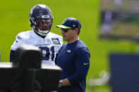Seattle Seahawks defensive tackle Byron Murphy II talks with head coach Mike Macdonald during the NFL football team's rookie minicamp Friday, May 3, 2024, in Renton, Wash. (AP Photo/Lindsey Wasson)