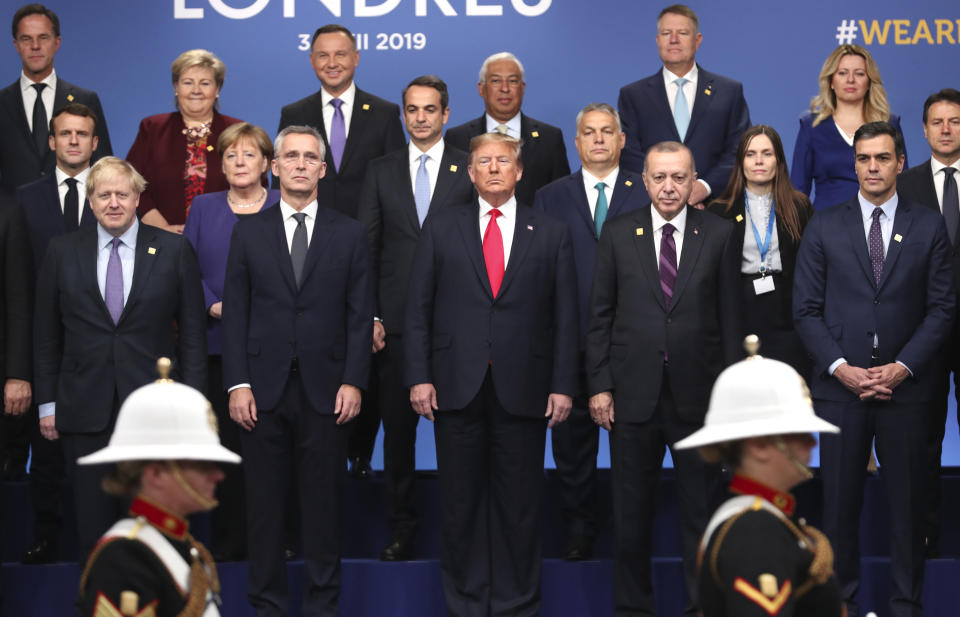From front row left, British Prime Minister Boris Johnson, NATO Secretary General Jens Stoltenberg, U.S. President Donald Trump, Turkish President Recep Tayyip Erdogan and Spanish Prime Minister Pedro Sanchez attend a ceremony event during a NATO leaders meeting at The Grove hotel and resort in Watford, Hertfordshire, England, Wednesday, Dec. 4, 2019. NATO Secretary-General Jens Stoltenberg rejected Wednesday French criticism that the military alliance is suffering from brain death, and insisted that the organization is adapting to modern challenges. (AP Photo/Francisco Seco)
