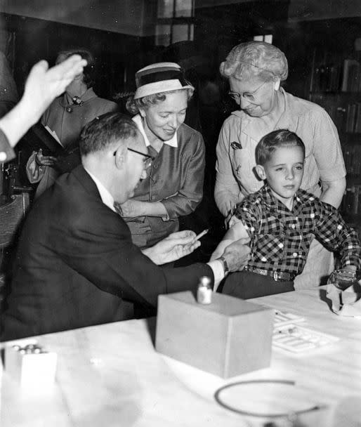 PHOTO: A doctor administers a polio vaccine shot as inoculation of school children begins at St. John's parochial school in Quincy, Mass., on May 12, 1954. (Boston Globe via Getty Images, FILE)