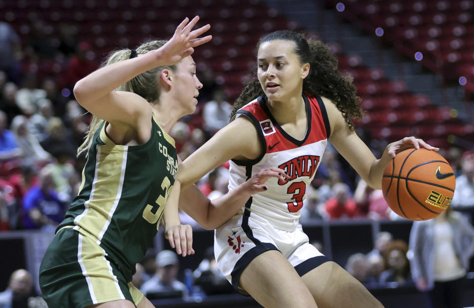 Colorado State guard Hannah Ronsiek (30) defends as UNLV guard Kiara Jackson (3) looks for an outlet in the first half of an NCAA college basketball game in the semifinals of the Mountain West Conference tournament, Tuesday, March 12, 2024, in Las Vegas. (Steve Marcus/Las Vegas Sun via AP)