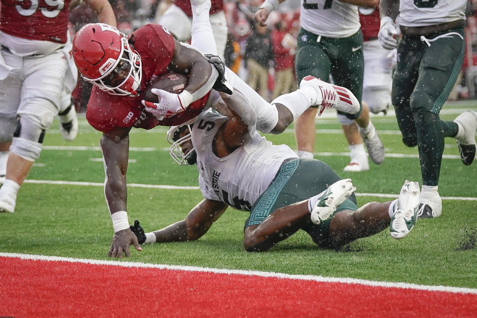 Rutgers running back Kyle Monangai (5) leaps into the end zone to score a touchdown during the fourth quarter of an NCAA college football game against Michigan State, Saturday, Oct. 14, 2023, in Piscataway, N.J. (AP Photo/Bryan Woolston)