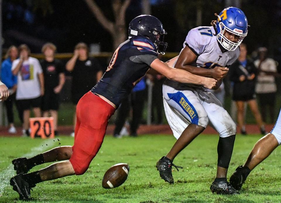 Josh Roberts of Eau Gallie forces Titusville QB Josiah Allen to fumble the ball during their 2023 football kickoff classic game Friday, August 18, 2023. Titusville’s Jamarion Stephens recoverd the fumble for the Terriers. Craig Bailey/FLORIDA TODAY via USA TODAY NETWORK